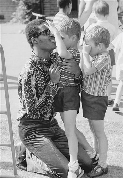 Stevie Wonder at a home for the blind, London, 1970