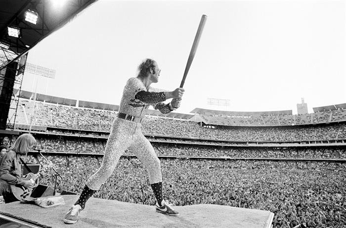 Elton John with baseball  bat 1975