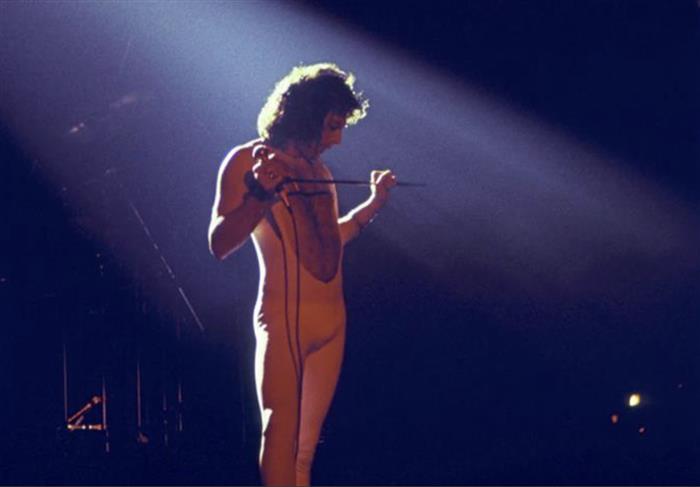 Freddie Mercury lead singer of The Queen  on stage color 